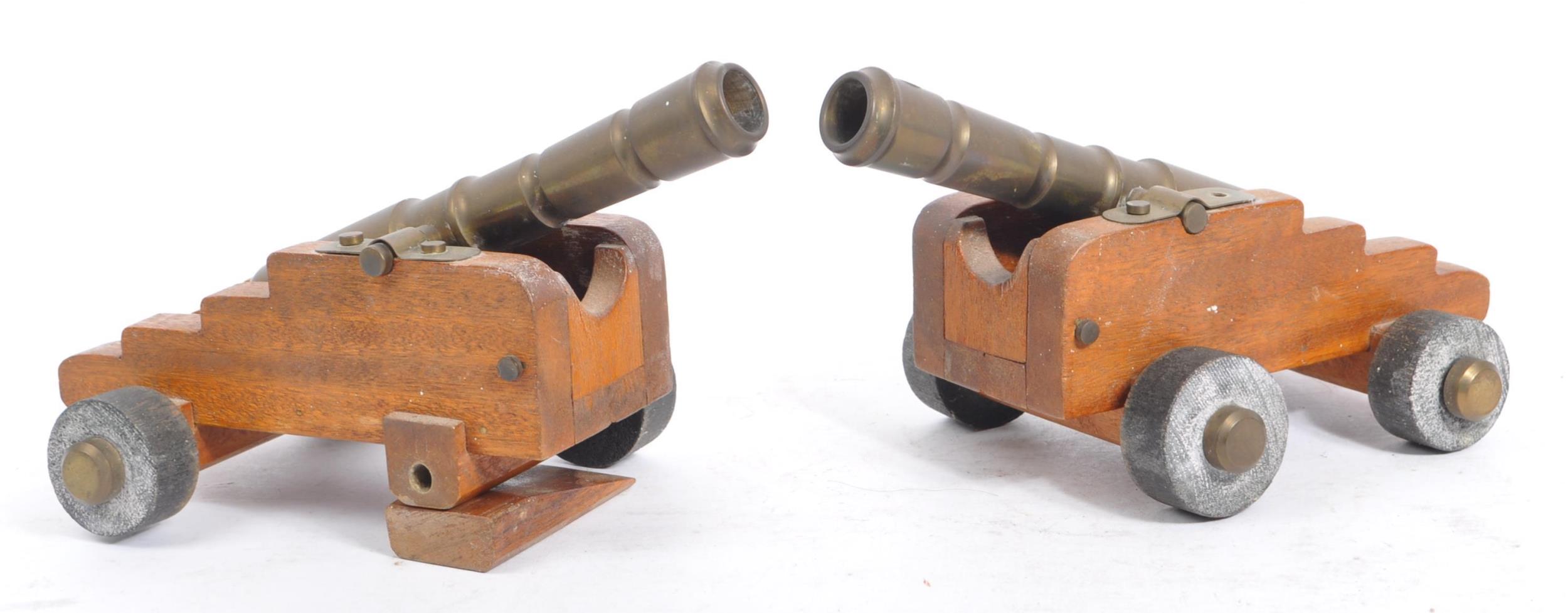 PAIR OF EARLY 20TH CENTURY WOODEN & BRASS DESK CANNONS