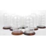 SEVEN 20TH CENTURY CIRCULAR GLASS & PLASTIC DISPLAY DOMES