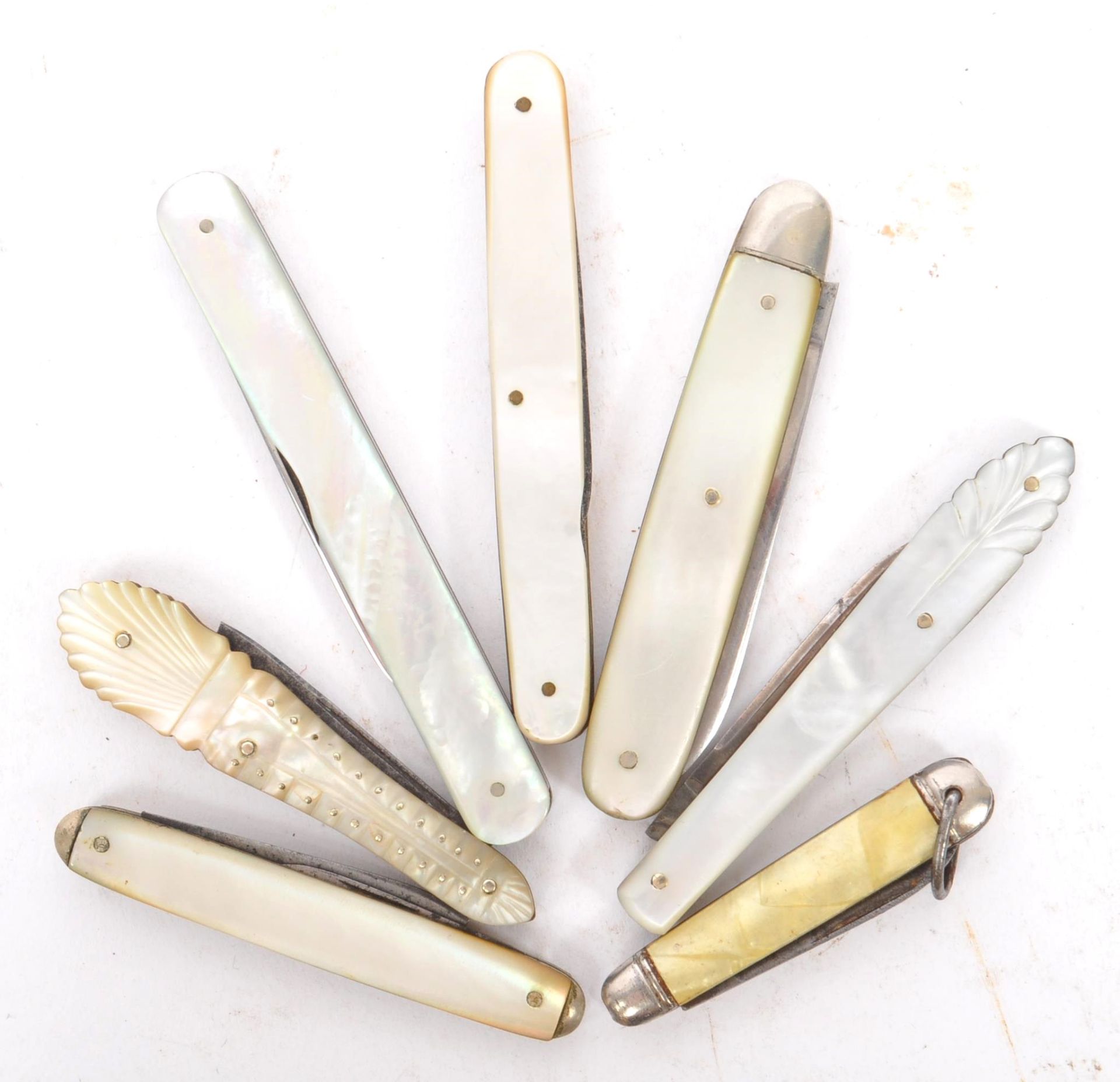 COLLECTION OF SEVEN MOTHER OF PEARL FRUIT KNIVES