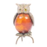 AN EARLY 20TH CENTURY 1930S OWL FIGURINE TAPE MEASURE