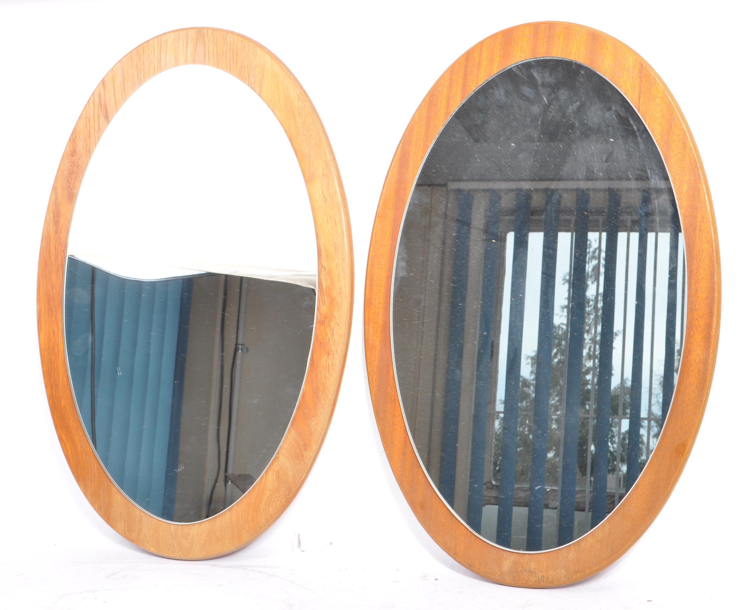 TWO MATCHING RETRO MID CENTURY 1970S TEAK FRAMED WALL MIRRORS