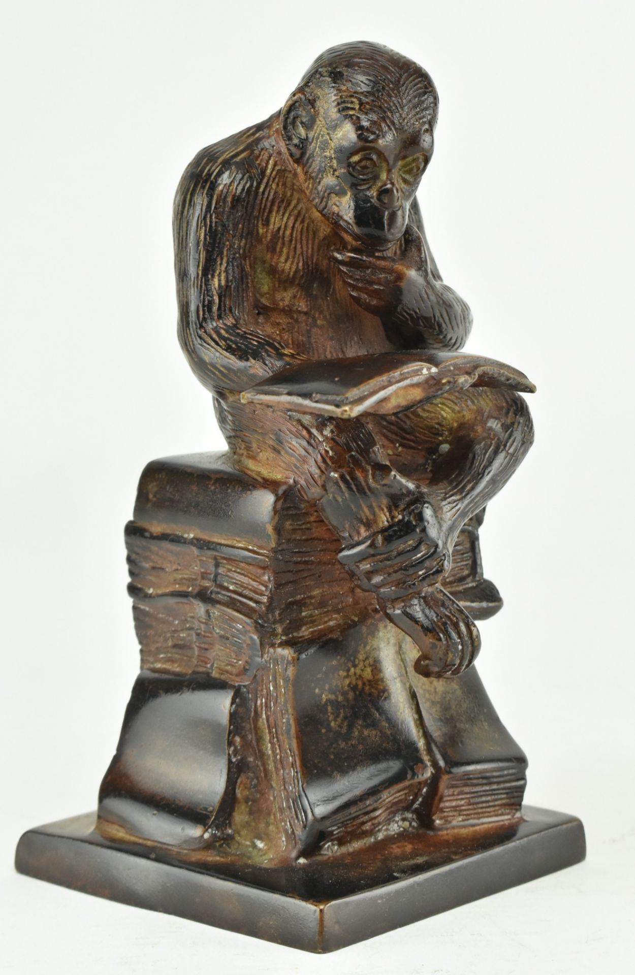 BRONZE FIGURE OF DARWIN'S MONKEY READING BOOK