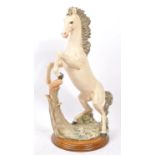 LARGE RESIN FIGURE OF REARING HORSE