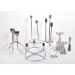 COLLECTION OF EIGHT 1980S STAINLESS STEEL CANDLE HOLDERS