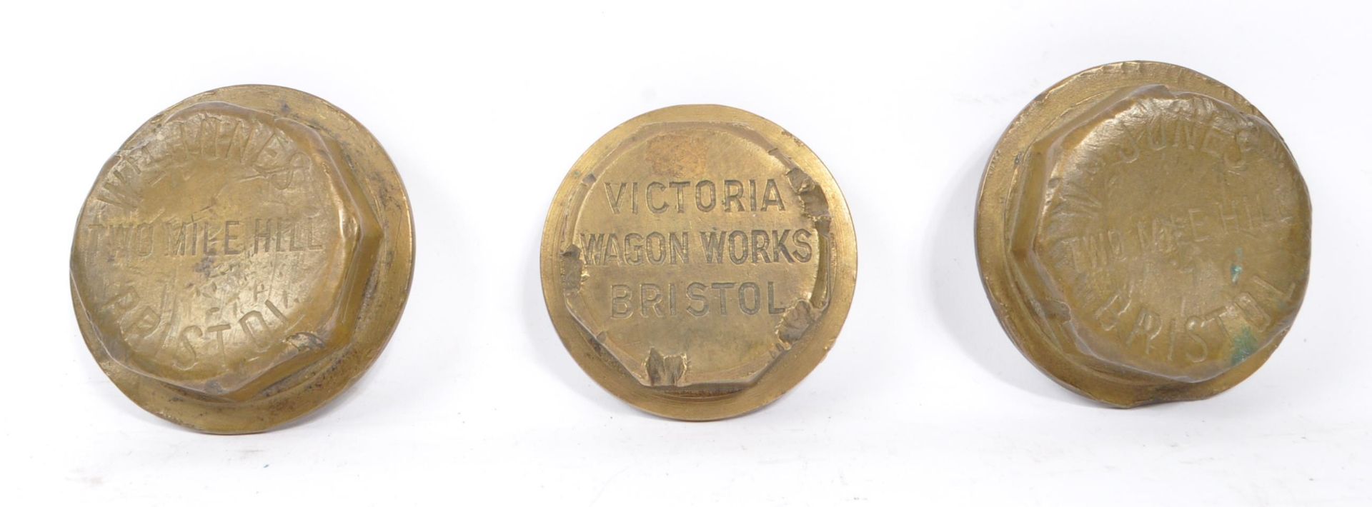 COLLECTION OF THREE BRISTOL WAGON WHEEL CAPS