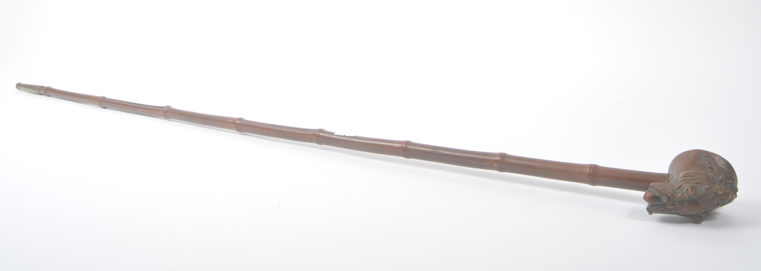 BURMESE BAMBOO OPIUM PIPE WITH CARVED WOOD DECORATION