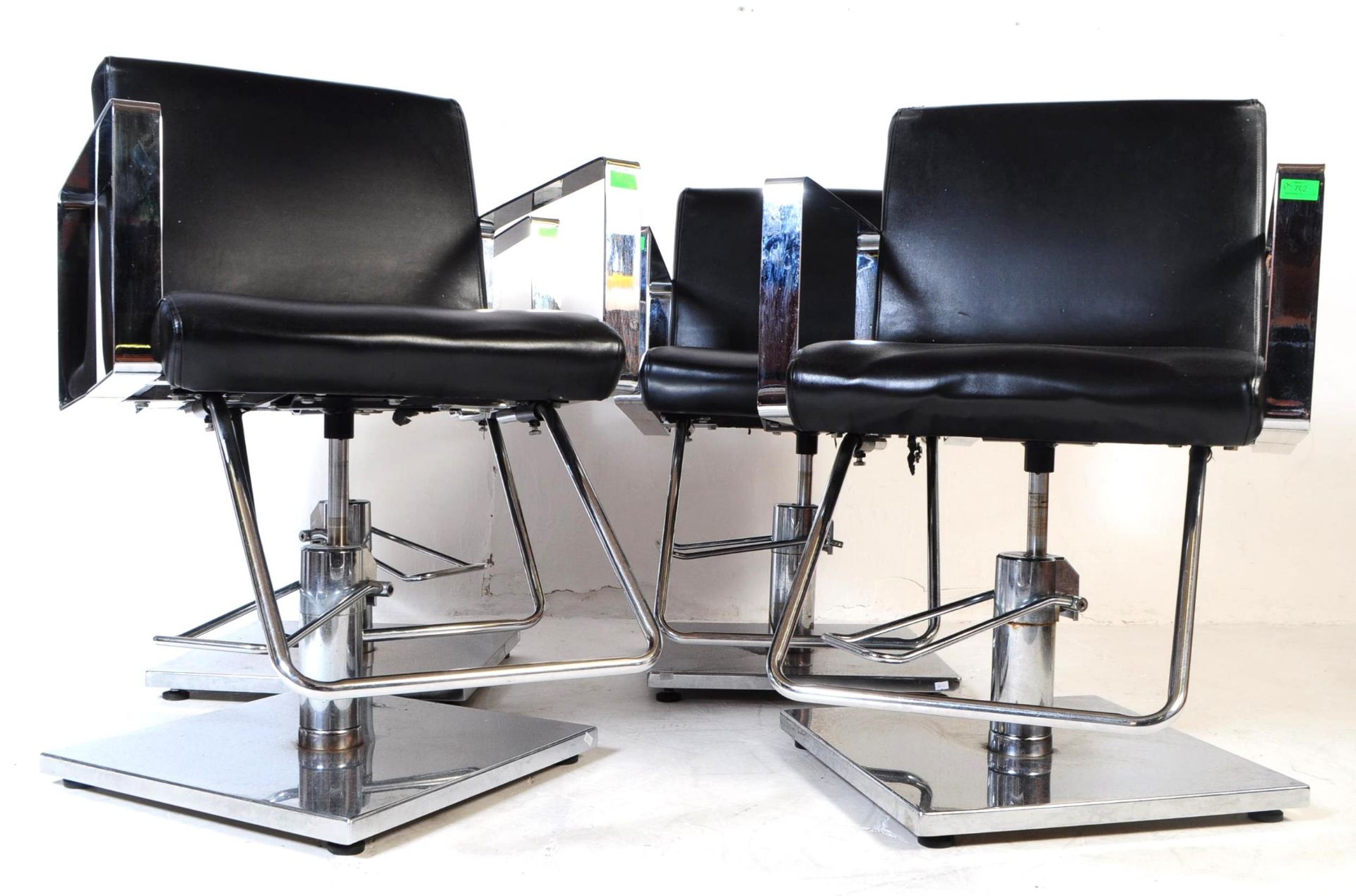 FOUR CONTEMPORARY BLACK VINYL SALON BARBER CHAIRS / ARMCHAIRS