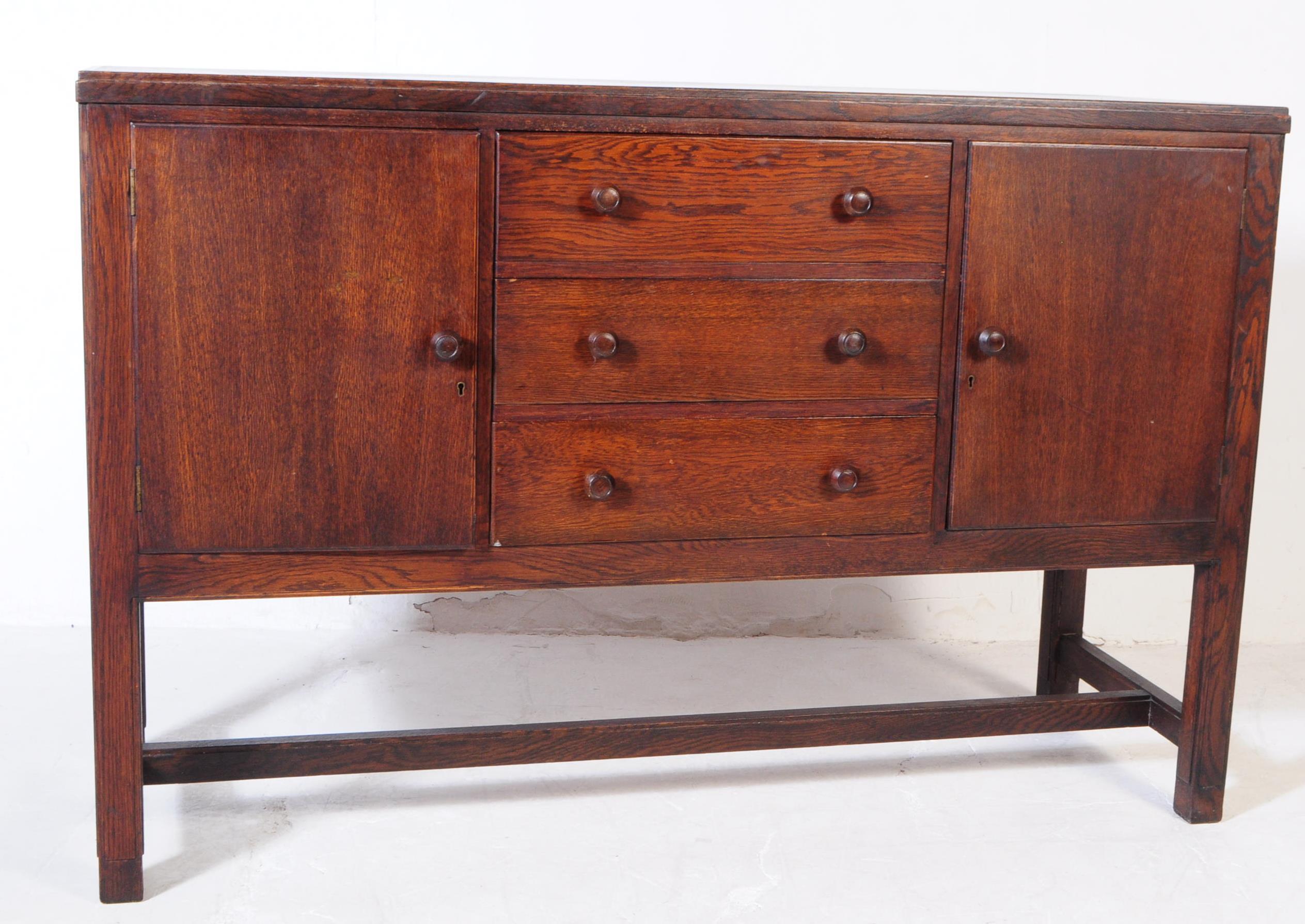 H MORRIS - COTSWOLD - MID 20TH CENTURY OAK SIDEBOARD