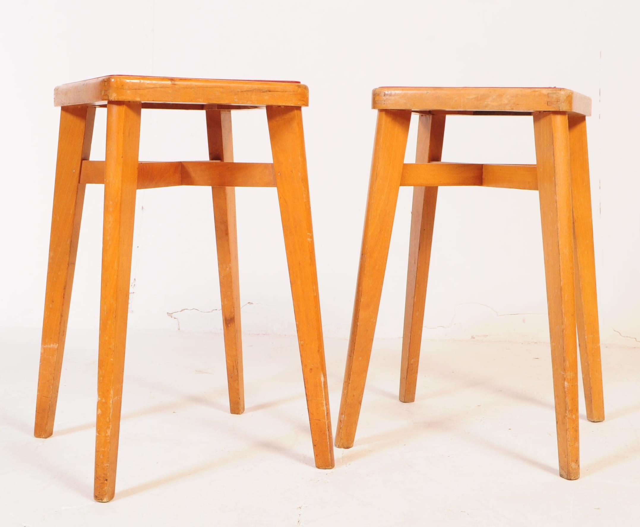 PAIR OF MID CENTURY YUGOSLAVIAN STOOLS WITH RED VINYL