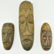 THREE RUSTIC AFRICAN TRIBAL WOODEN WALL MASKS