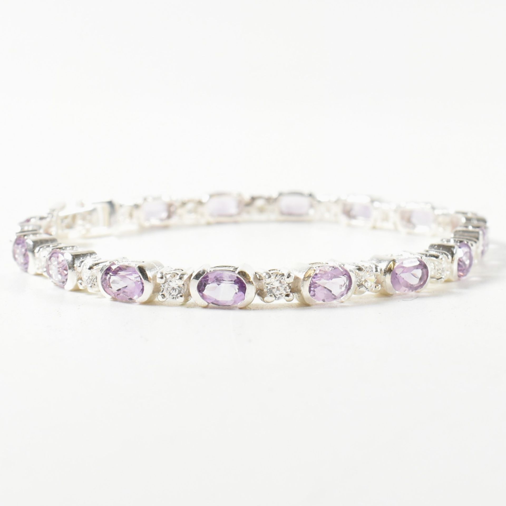 A 925 SILVER AMETHYST & CZ LINE BRACELET