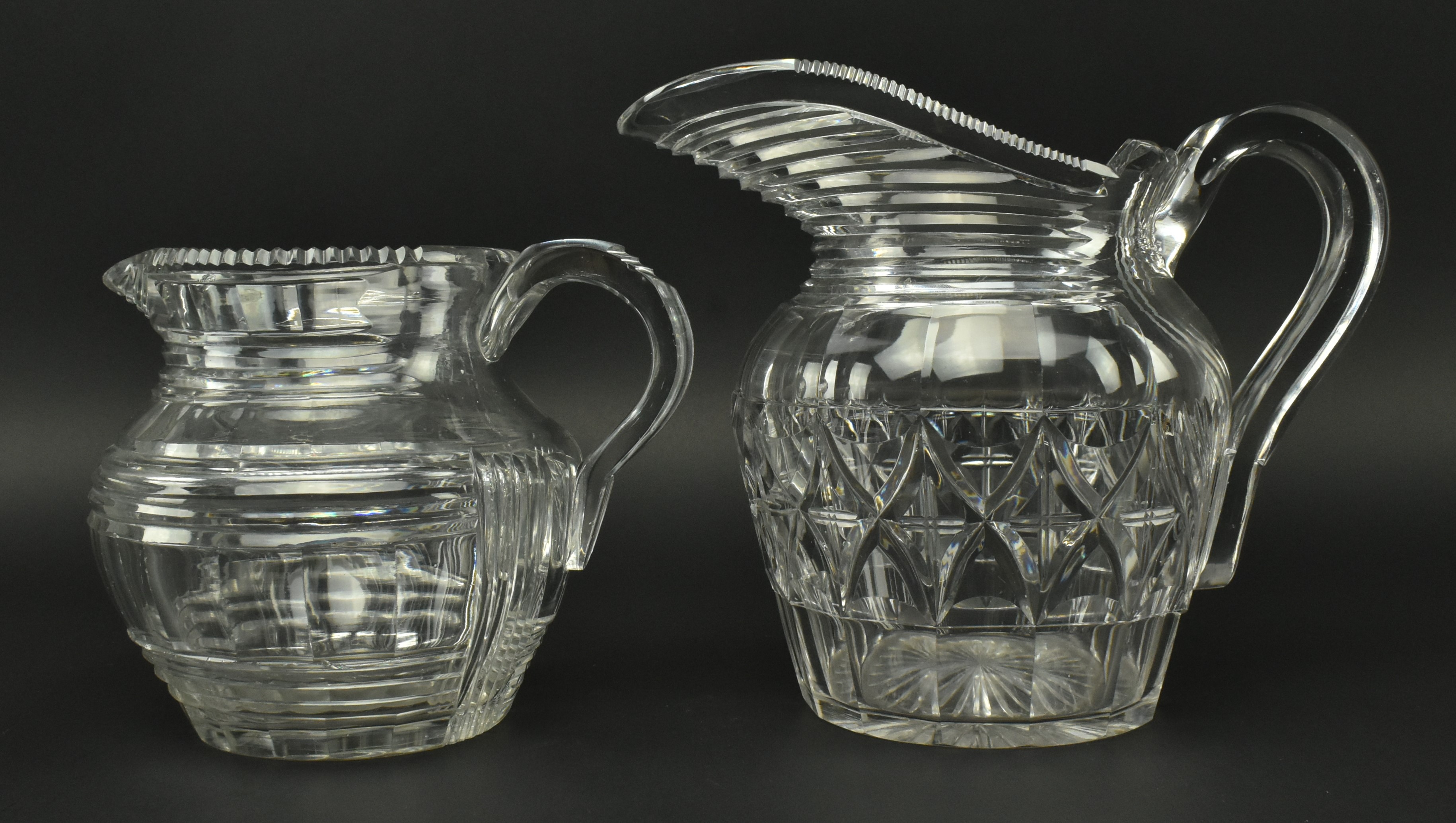 FOUR EARLY 19TH CENTURY GLASS JUGS WITH STEP CUT DESIGN - Image 7 of 11