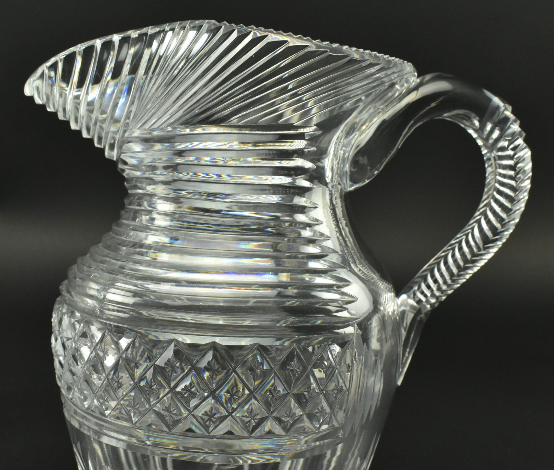 FOUR EARLY 19TH CENTURY GLASS JUGS WITH STEP CUT DESIGN - Image 5 of 11