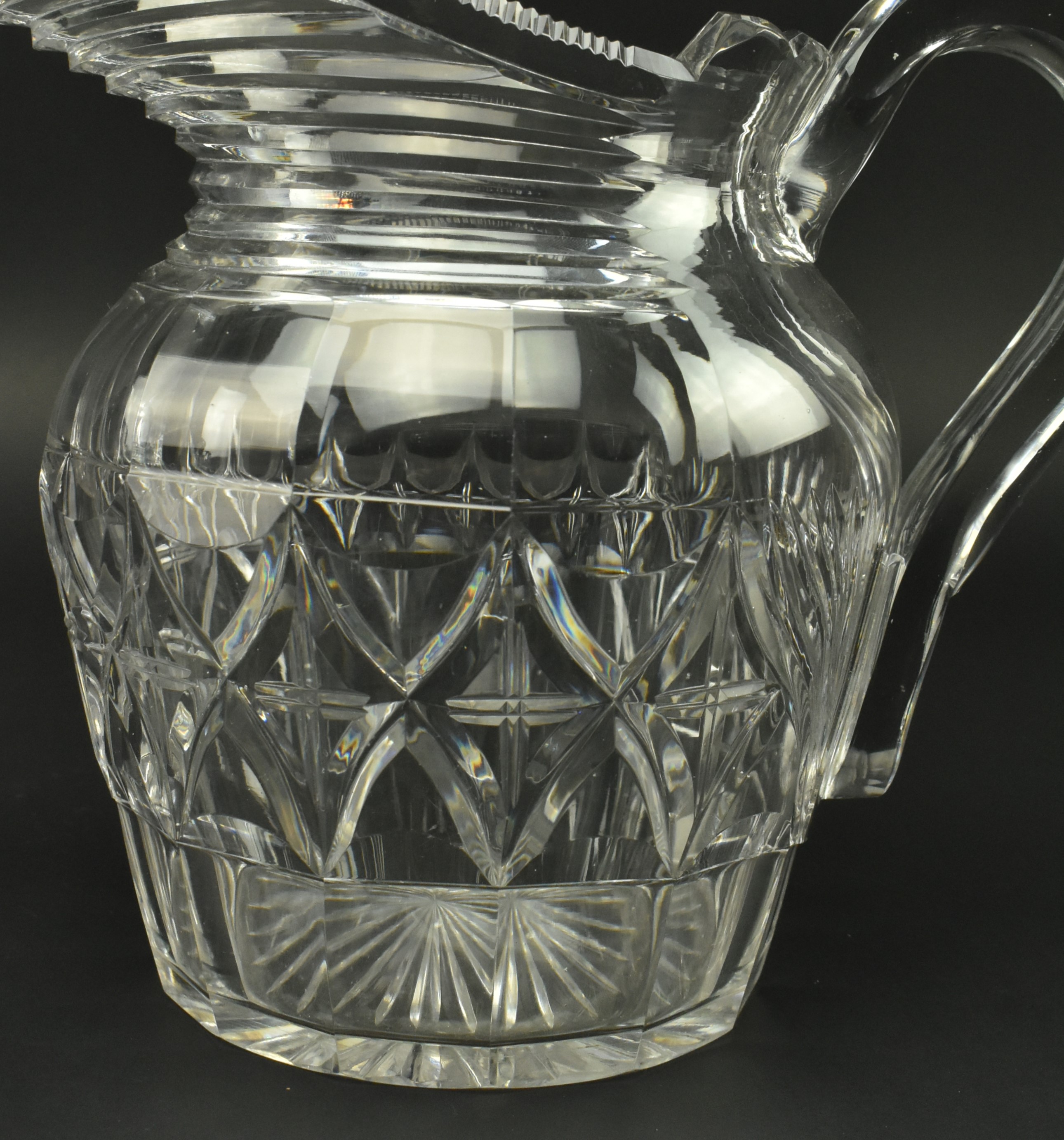 FOUR EARLY 19TH CENTURY GLASS JUGS WITH STEP CUT DESIGN - Image 10 of 11
