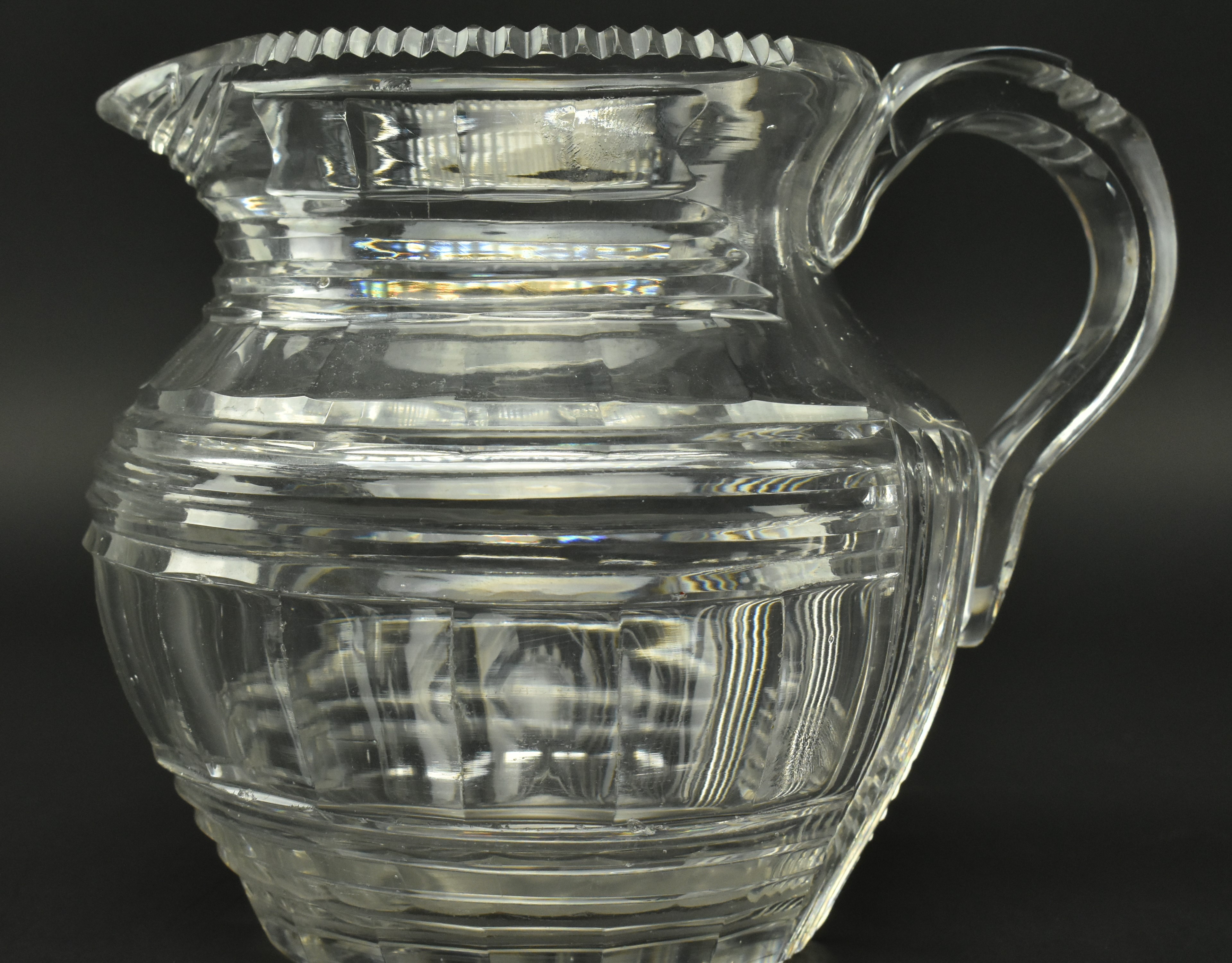 FOUR EARLY 19TH CENTURY GLASS JUGS WITH STEP CUT DESIGN - Image 9 of 11