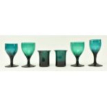 FOUR EARLY 19TH CENTURY GREEN WINE GLASSES & TWO BEAKERS