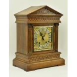 GERMAN EIGHT DAY OAK CASED CARVED MANTEL CLOCK