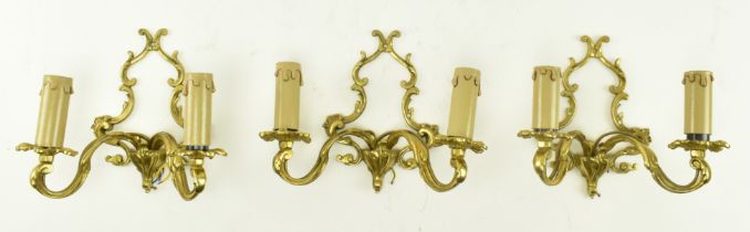 THREE FRENCH STYLE ROCOCO INSPIRED GILDED METAL WALL SCONCES