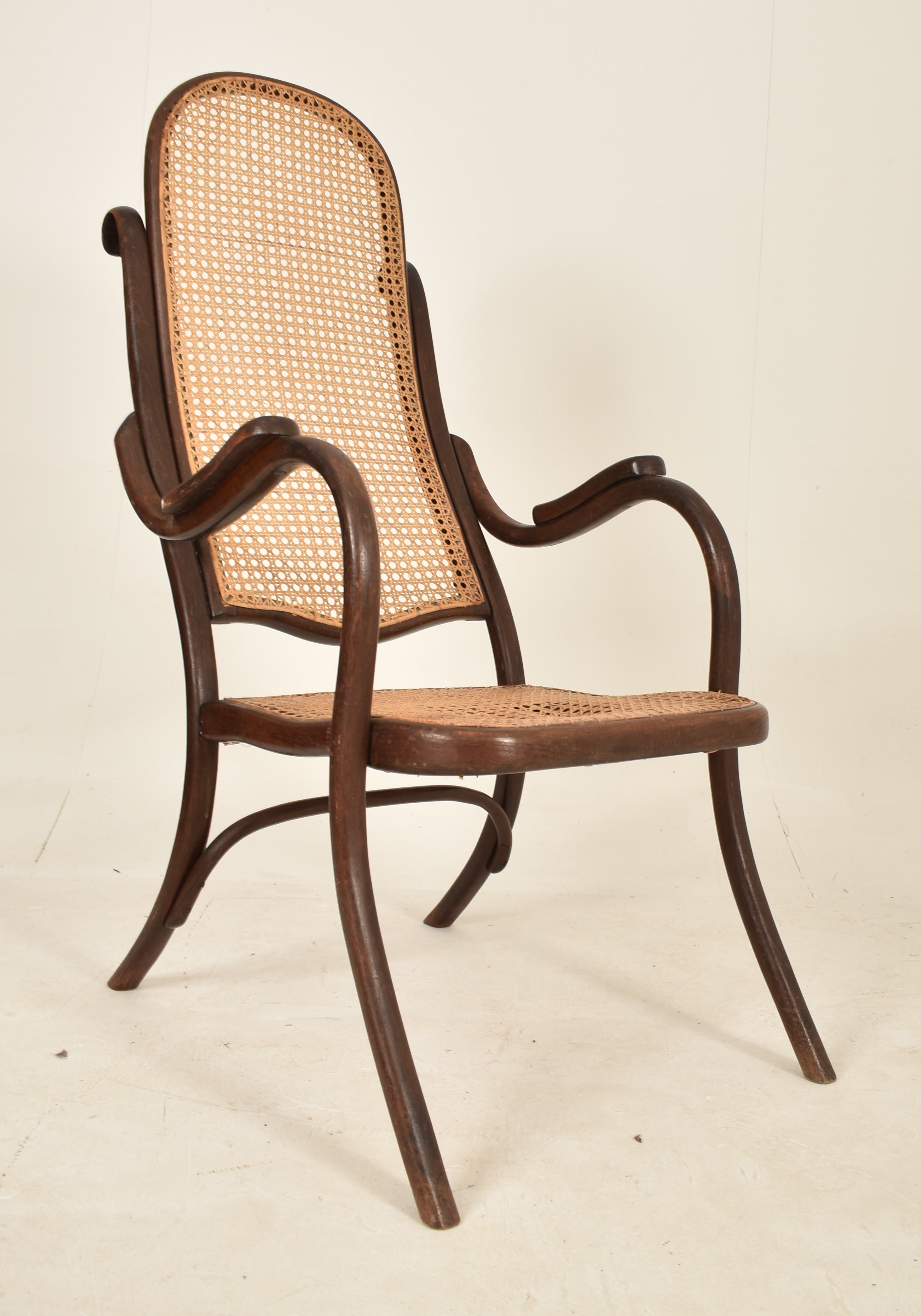 THONET - EARLY 20TH CENTURY BENTWOOD & CANE FIRESIDE ARMCHAIR