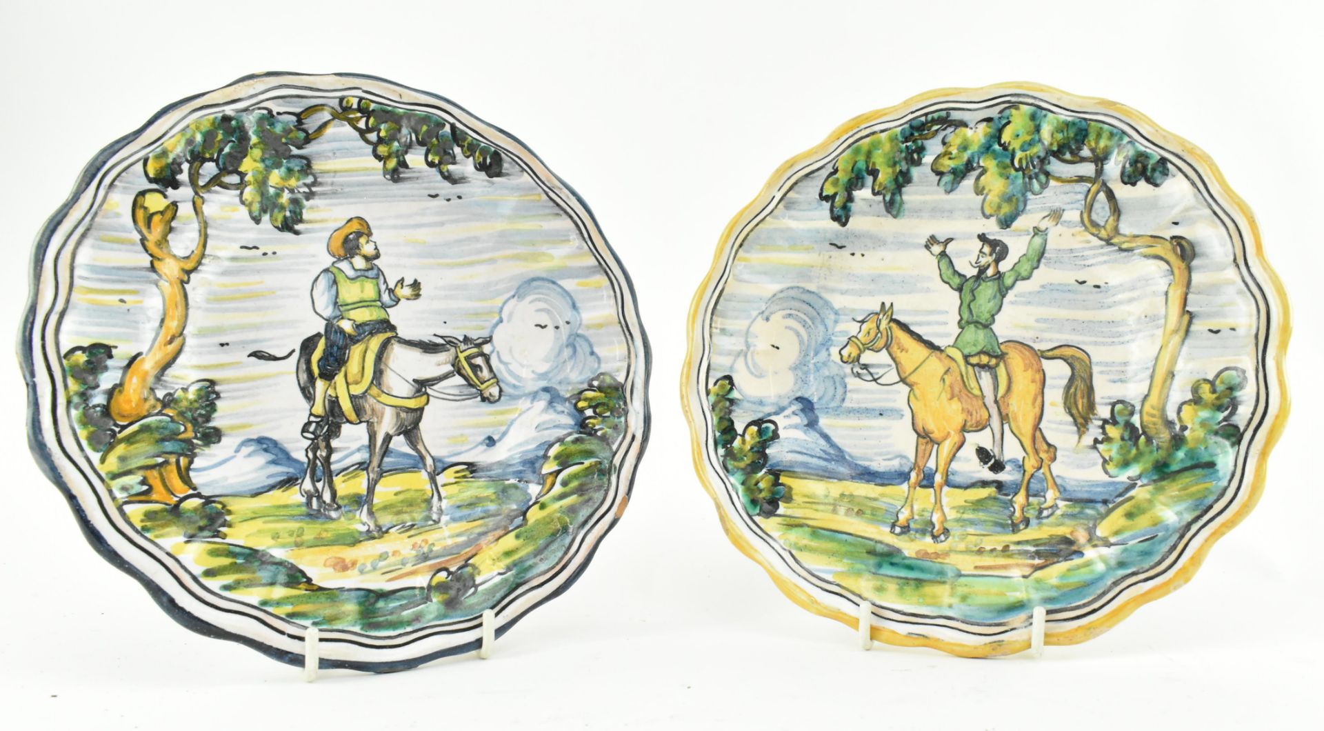 TWO SPANISH MAJOLICA TALAVERA WALL PLATES FEATURING RIDERS