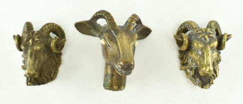 COLLECTION OF THREE BRONZE MODELLED HEADS OF RAMS