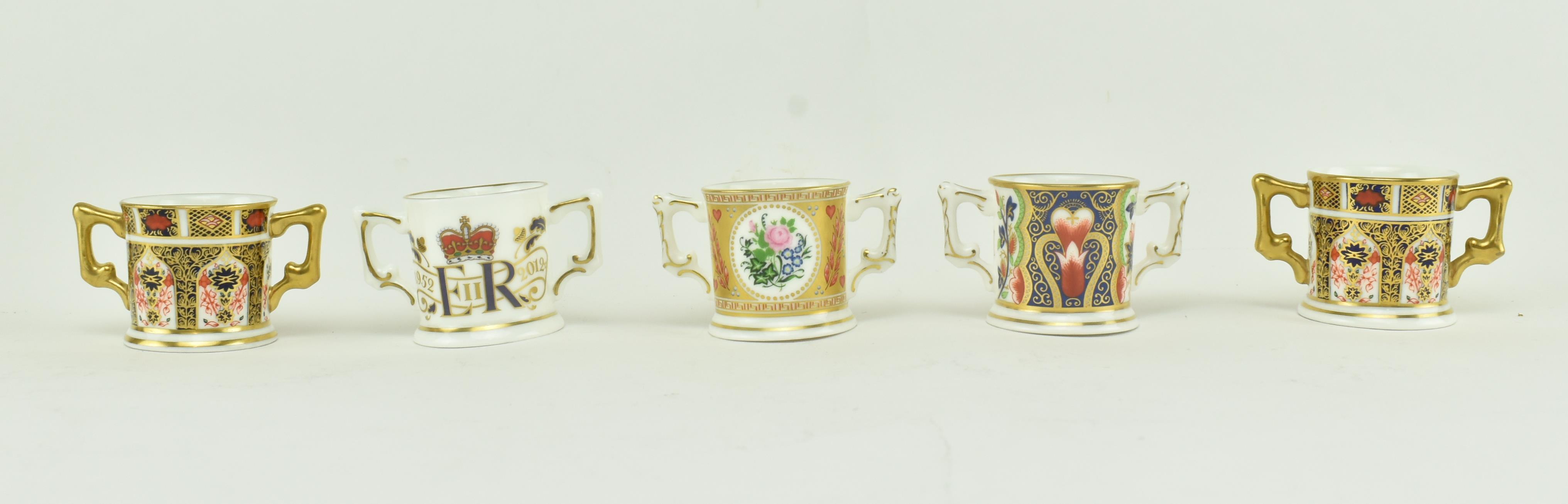 A COLLECTION OF ROYAL CROWN DERBY MINIATURE LOVING CUPS - Image 2 of 8