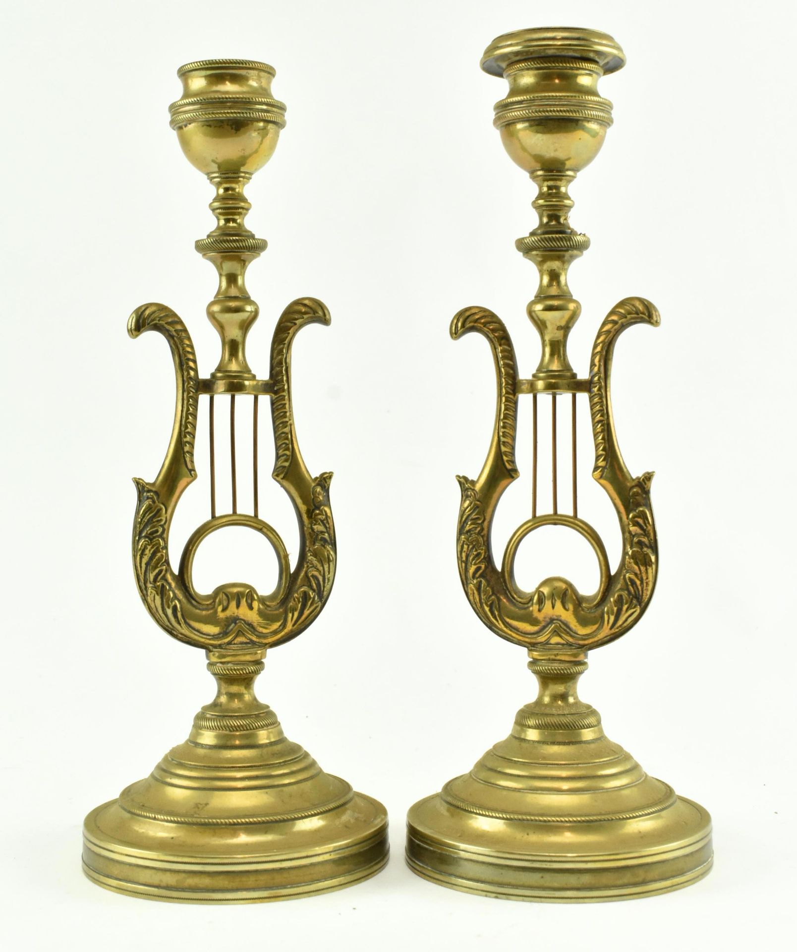 PAIR OF 19TH CENTURY BRASS CANDLESTICKS WITH CENTRAL LYRE