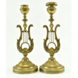 PAIR OF 19TH CENTURY BRASS CANDLESTICKS WITH CENTRAL LYRE