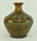 CONTINENTAL GREEN AND BROWN GLAZED POTTERY WITH RELIEF MOTIF