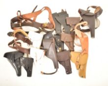 COLLECTION OF ASSORTED GUN / PISTOLS HOLSTERS & BELTS