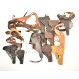 COLLECTION OF ASSORTED GUN / PISTOLS HOLSTERS & BELTS