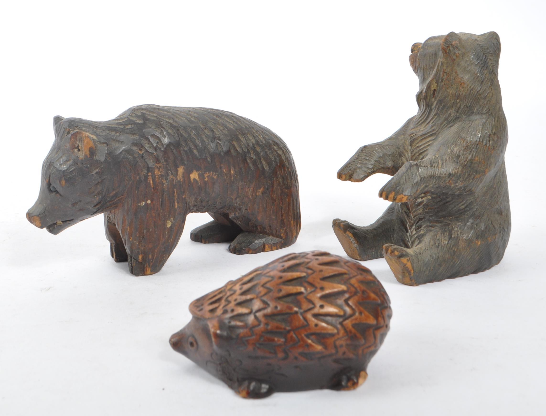 TWO BLACK FOREST HAND CARVED WOODEN BEARS WITH HEDGEHOG - Image 2 of 6