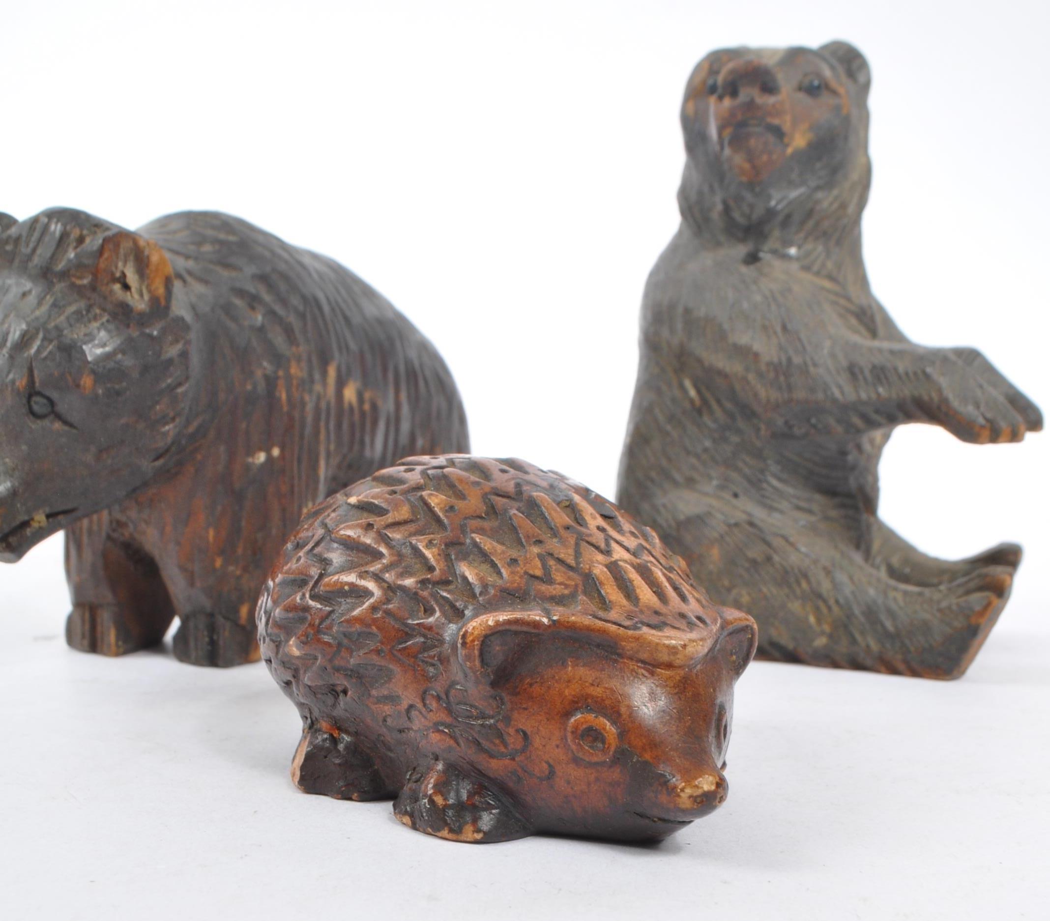 TWO BLACK FOREST HAND CARVED WOODEN BEARS WITH HEDGEHOG - Image 5 of 6