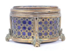 EARLY 20TH CENTURY BRASS AND BLUE GLASS TRINKET BOX