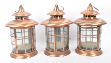 SET OF THREE 20TH CENTURY COPPER AND GLASS LANTERNS