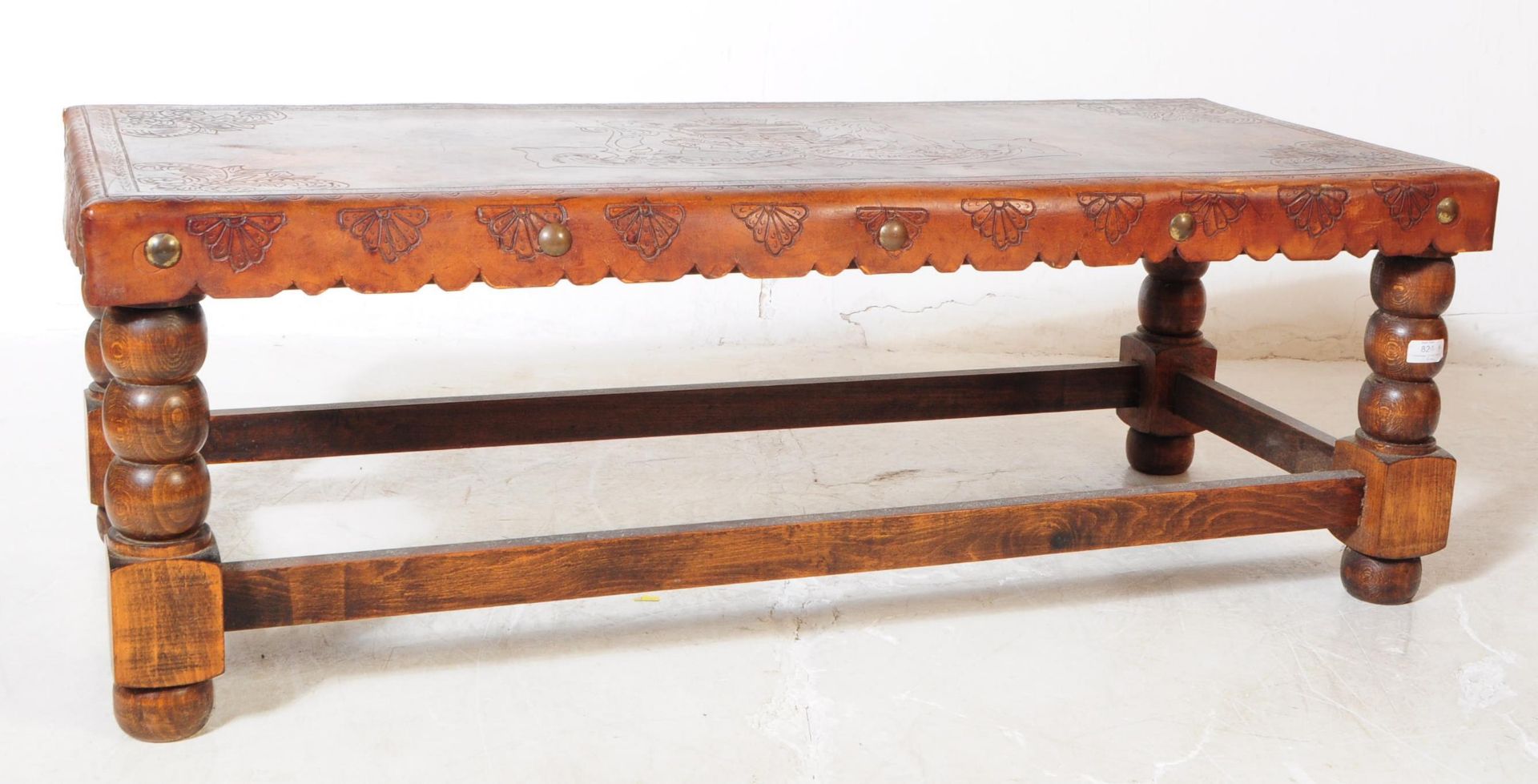 EARLY 20TH CENTURY LEATHER TOPPED OAK COFFEE TABLE