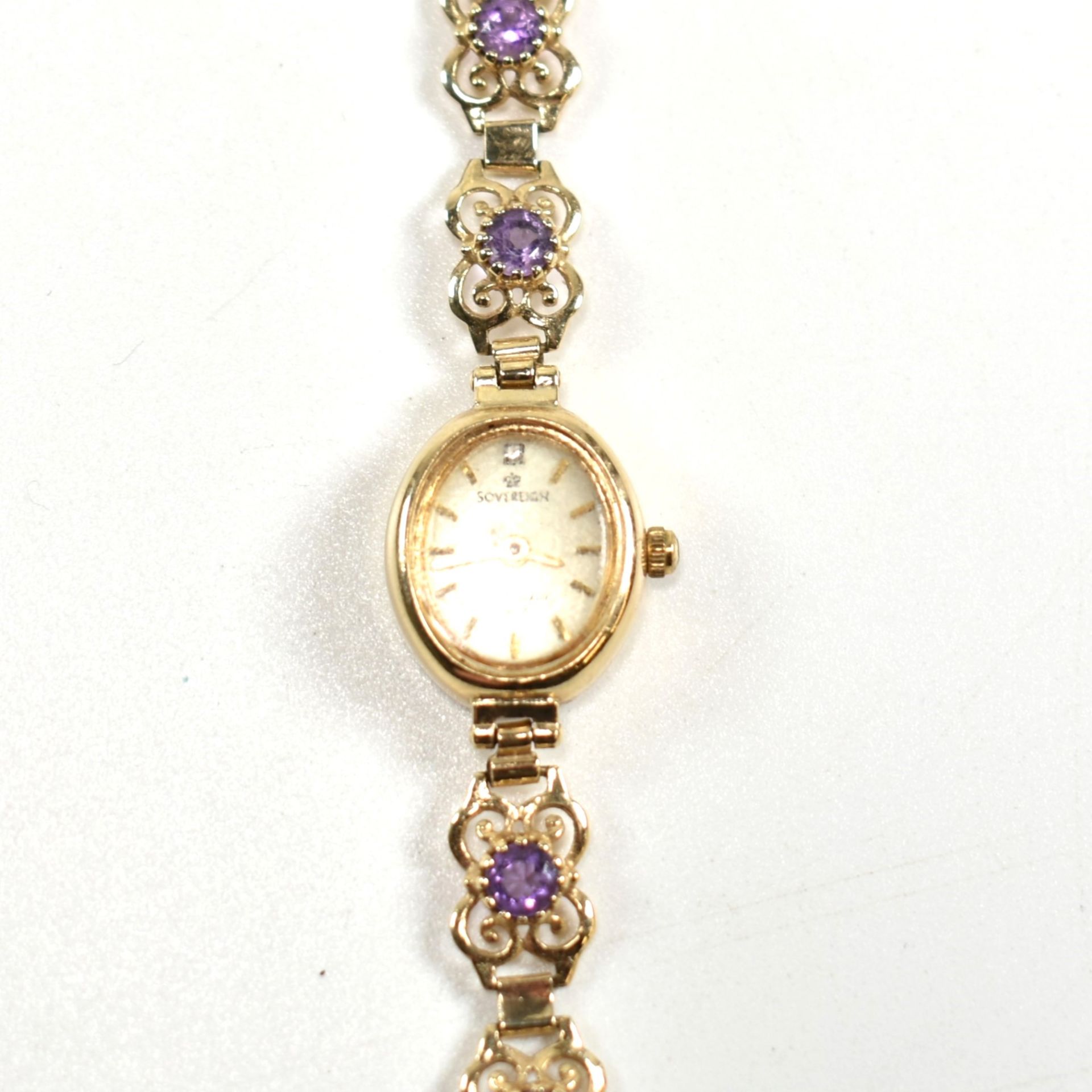 HALLMARKED 9CT GOLD SOVEREIGN WRISTWATCH WITH PURPLE STONES