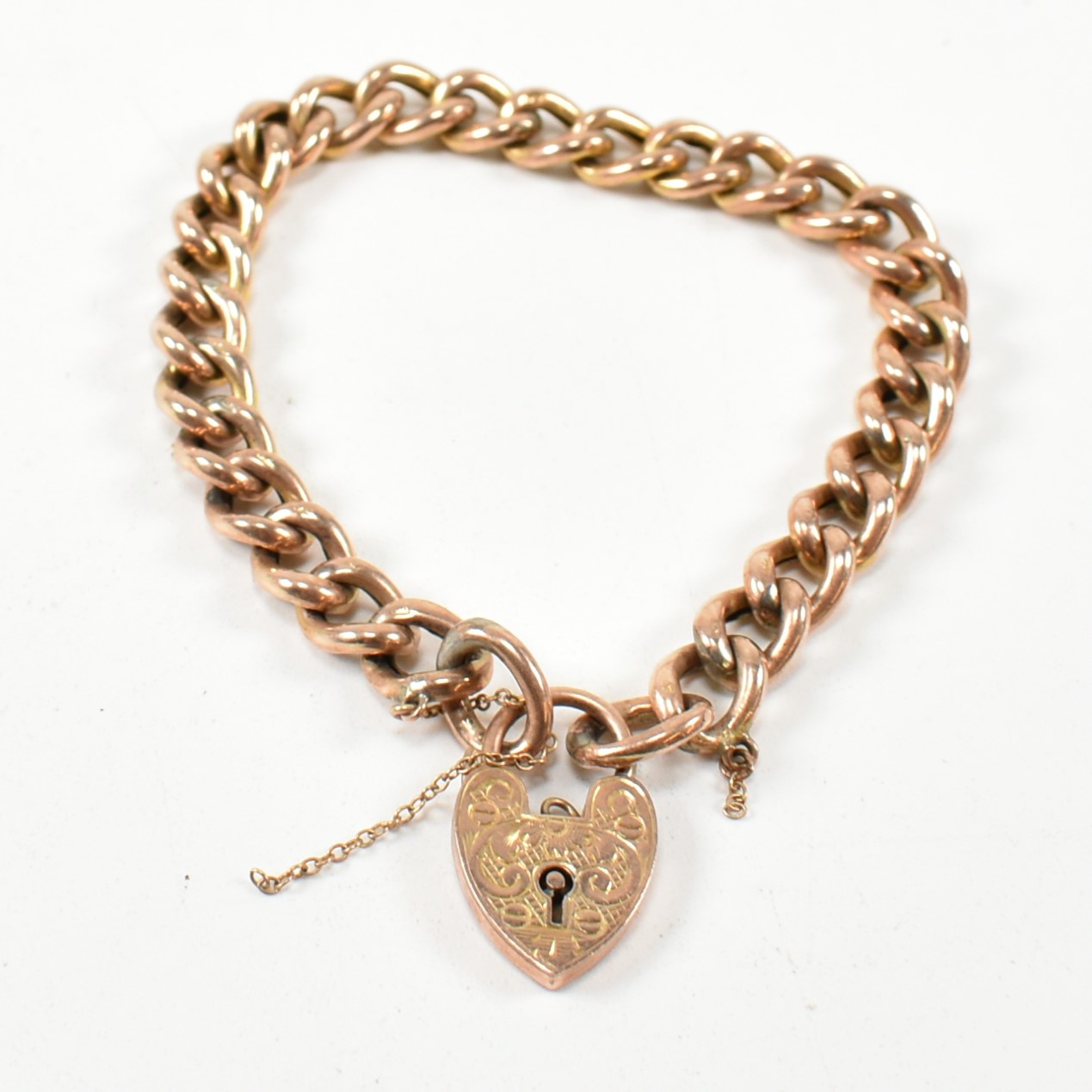 19TH CENTURY ROSE METAL CURB LINK BRACELET WITH 9CT GOLD HEART PADLOCK CLASP