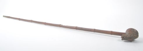 BURMESE BAMBOO OPIUM PIPE WITH CARVED WOOD DECORATION