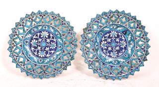 PAIR OF ISLAMIC BLUE PIERCED TIN GLAZED CHARGERS