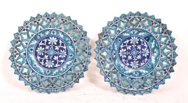 PAIR OF ISLAMIC BLUE PIERCED TIN GLAZED CHARGERS