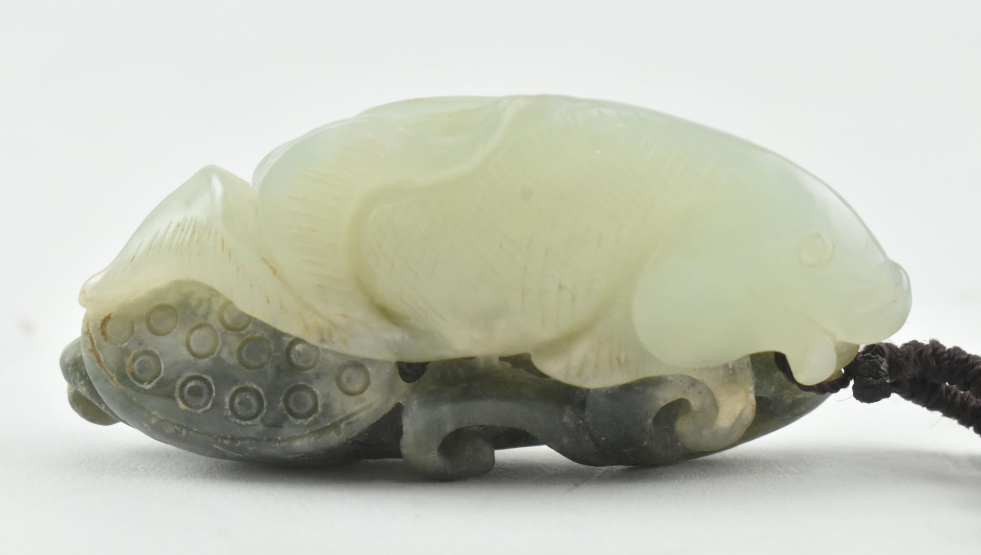 JADE FIGURE OF A FISH WITH LOTUS AND RUYI 年年有余，年年如意玉佩