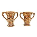 PAIR OF VICTORIAN STONEWARE TWIN HANDLED BACCHUS CUPS