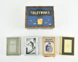 COLLECTION OF FOUR PLAYING CARDS AND A TIDLEY WINKS SET