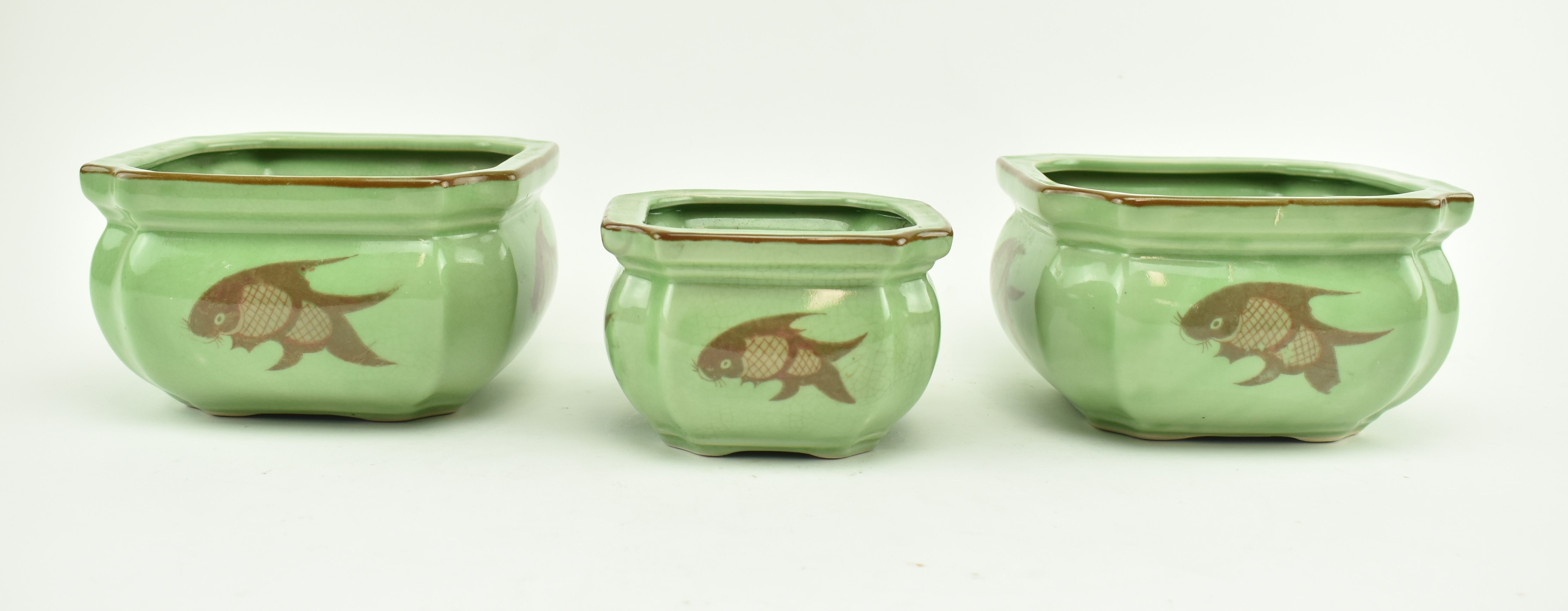 COLLECTION OF THREE CHINESE CRACKLE CERAMIC KOI FISH POTS