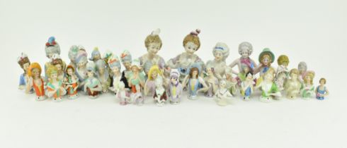 COLLECTION OF FORTY PORCELAIN PIN CUSHION DOLLS HEADS