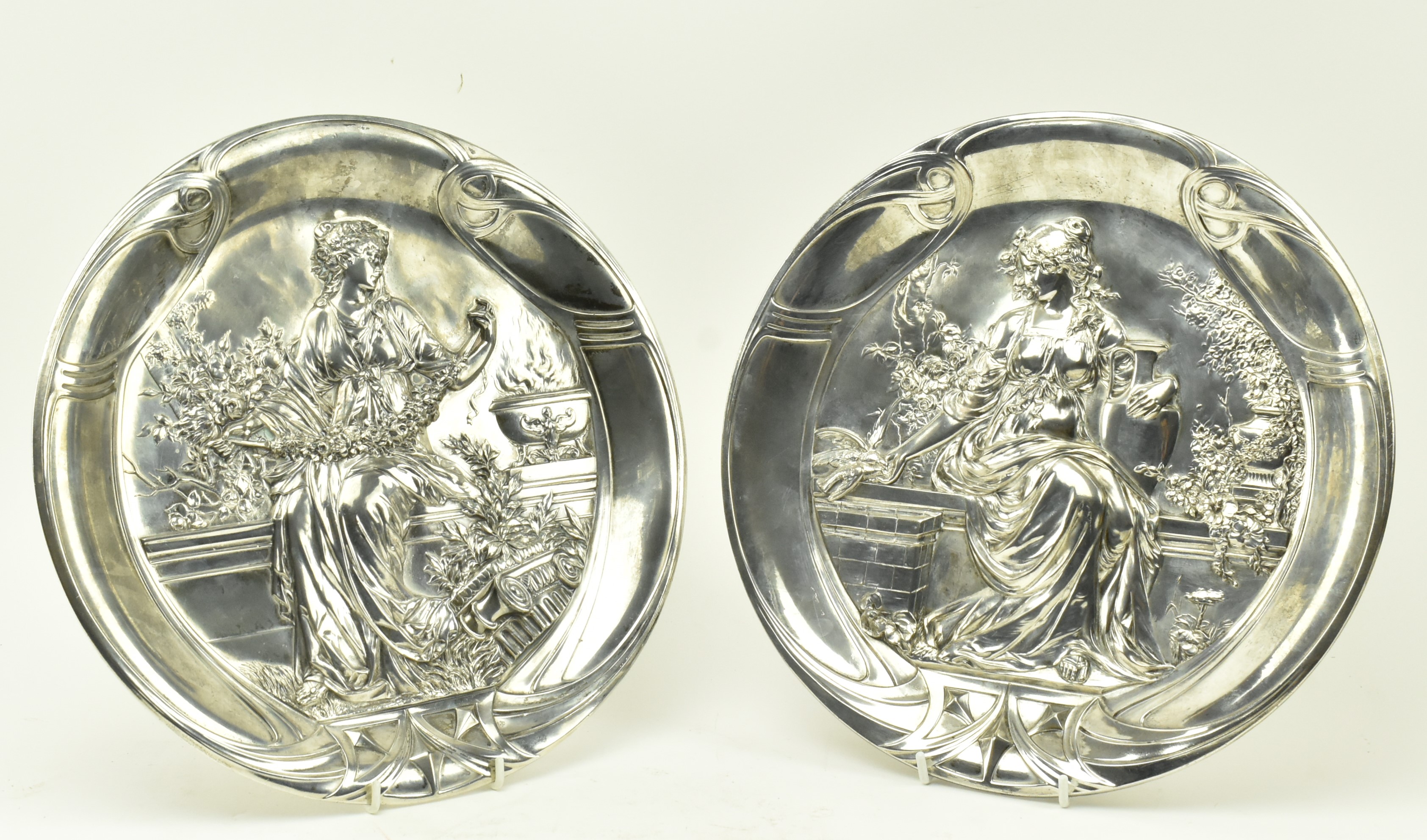 PAIR OF WMF ART NOUVEAU SILVER PLATED ALLEGORICAL CHARGERS