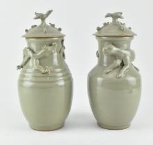 PAIR OF LONGQUAN CELADON FUNERARY URNS 青釉贴花龙虎尊 一对