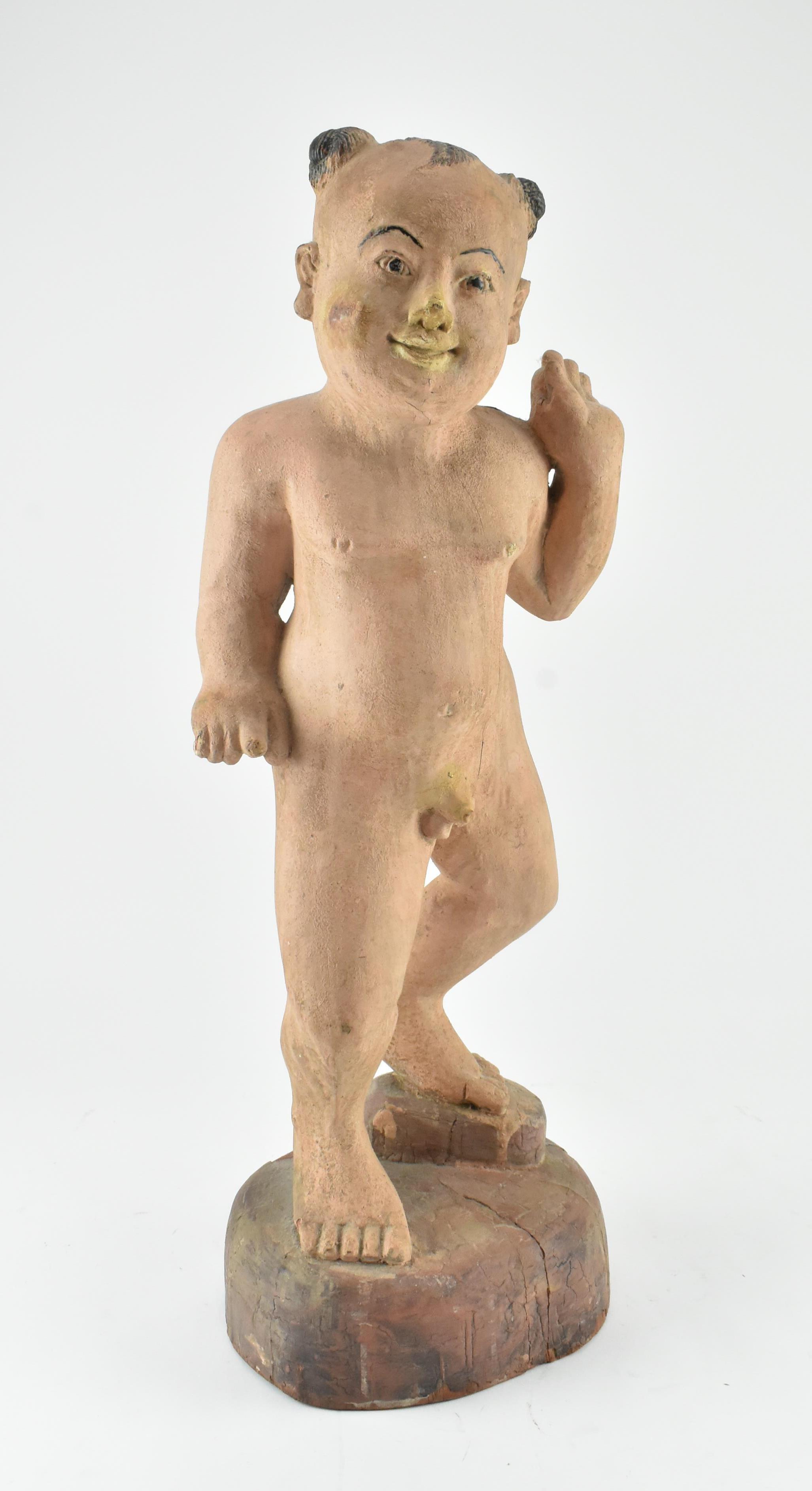 CHINESE CARVED WOODEN STATUE OF A CHILD 清 木刻童子