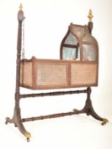 VICTORIAN MAHOGANY & RATTAN BACK ROCKING CRIB